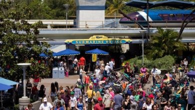 Guests gather outside the entrance of Disneyland Park's Finding Nemo Submarine Voyage ride in Tomorrowland