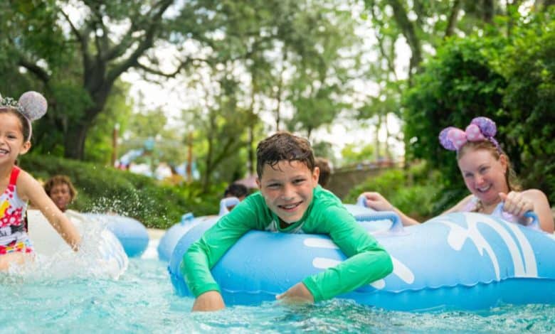 family in lazy river at disney world hotel