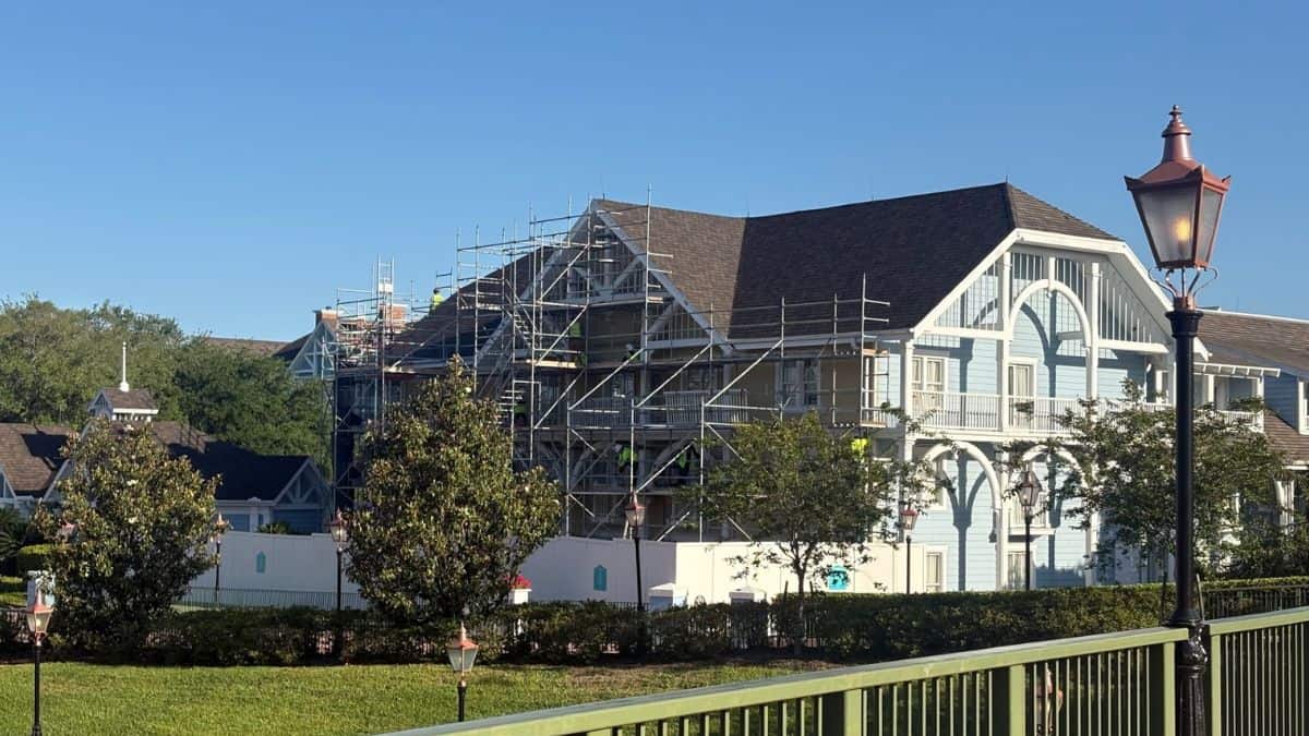 Disney’s Beach Club Resort featuring light blue exteriors, scaffolding, and ongoing refurbishments under sunny skies.