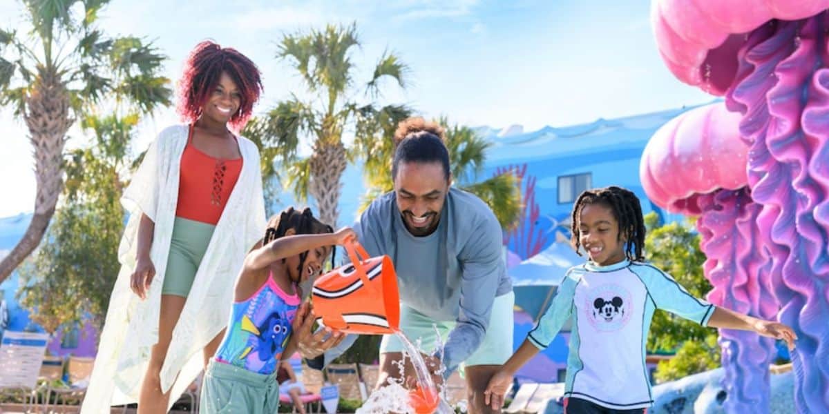 a family plays in finding nemo pool at disney's art of animation resort hotel