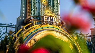 flowers in front of epic universe's entrance at universal orlando resort