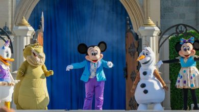 Mickey Mouse, Olaf, and friends take the stage before Cinderella Castle during the Magic Kingdom Welcome Show at Disney World