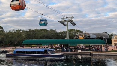 The Disney Skyliner and a ferry at the International Gateway entrance to EPCOT