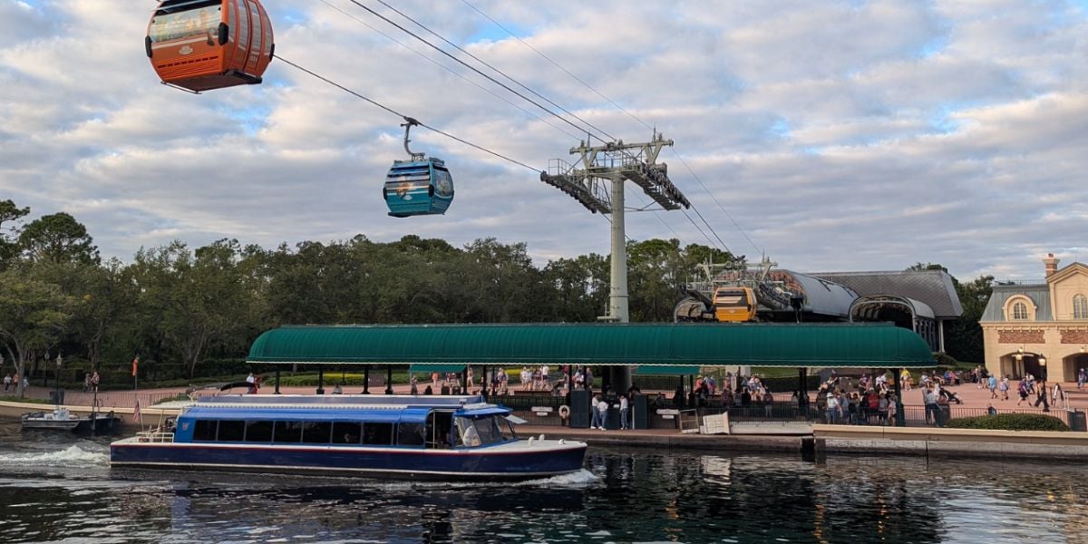 The Disney Skyliner and a ferry at the International Gateway entrance to EPCOT