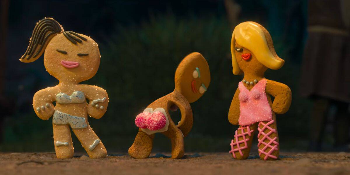 Gingy with two gingerbread girls dressed in scandalous outfits in 'Shrek 5'