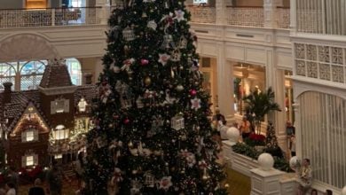 The lobby of Disney's Grand Floridian Resort & Spa at Christmas, including the life-size gingerbread house.