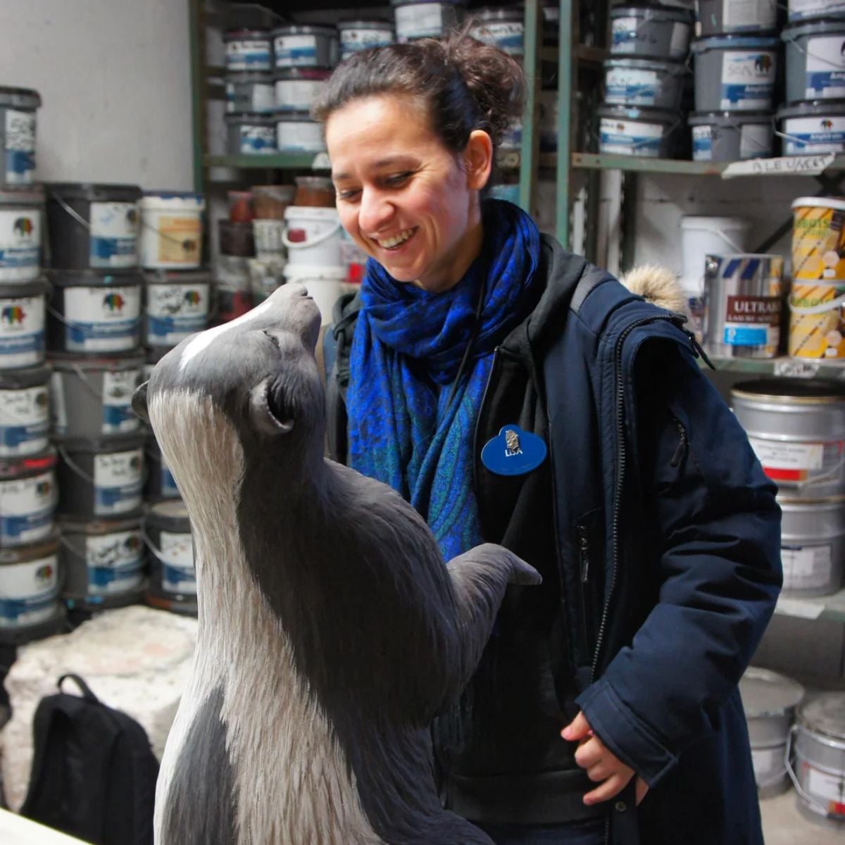 An imagineer working on a skunk figure.