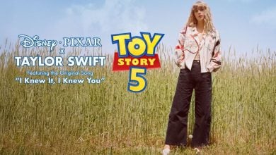 Taylor Swift poses in tall grass next to the Toy Story 5 logo and new song title, "I Knew It, I Knew You," on display.