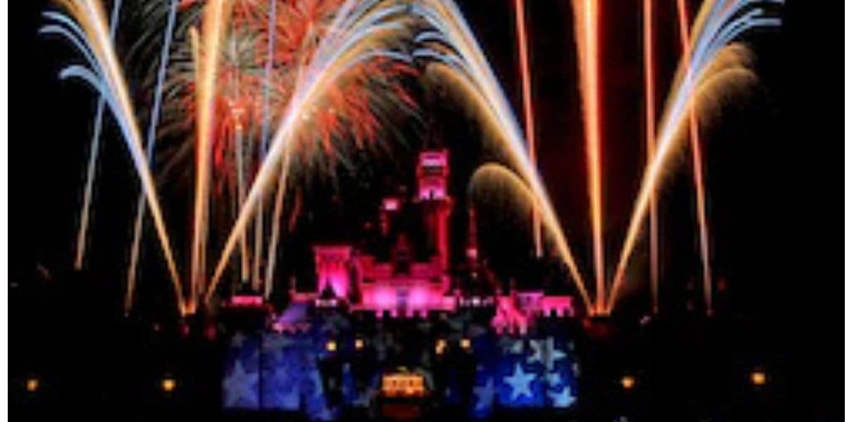 Vibrant fireworks burst over Disneyland's glowing castle as viewing areas close ahead of the Fourth of July spectacular.