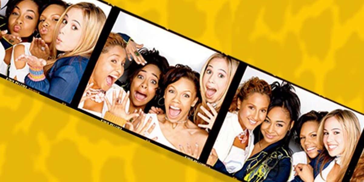 Four friends strike fun poses together in a series of three photo booth snapshots on a vibrant, carnival-themed yellow backdrop, capturing the playful spirit of a day at the amusement park.