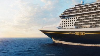 Disney Believe, helmed by the famous Captain Maria, glides across the ocean at sunset under partly cloudy skies, inviting guests to experience the magic and adventure of a Disney cruise.