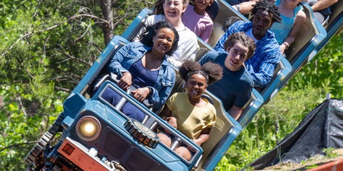 guests ride a roller coaster in Dollywood
