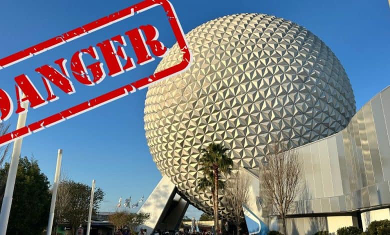 Epcot’s iconic geodesic Spaceship Earth shines under a clear blue sky, dramatically overlaid with a bold red “DANGER” stamp.