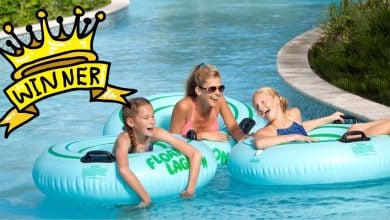 Guests float along the lazy river on colorful inner tubes, grinning beneath the Florida sun just steps away from Walt Disney World. A bold yellow “winner” crown graphic crowns the scene, celebrating a picture-perfect day in Orlando’s resort magic.