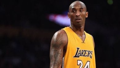 LeBron James in his iconic yellow Lakers jersey on the court, thrilling fans with live-game excitement.