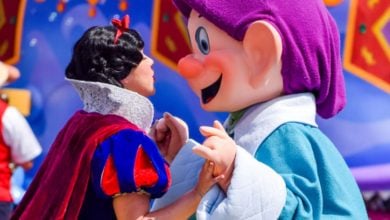 Snow White and Dopey dance during Disney World parade