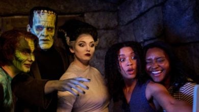 epic universe universal guests take a selfie with frankenstein and his bride in dark universe