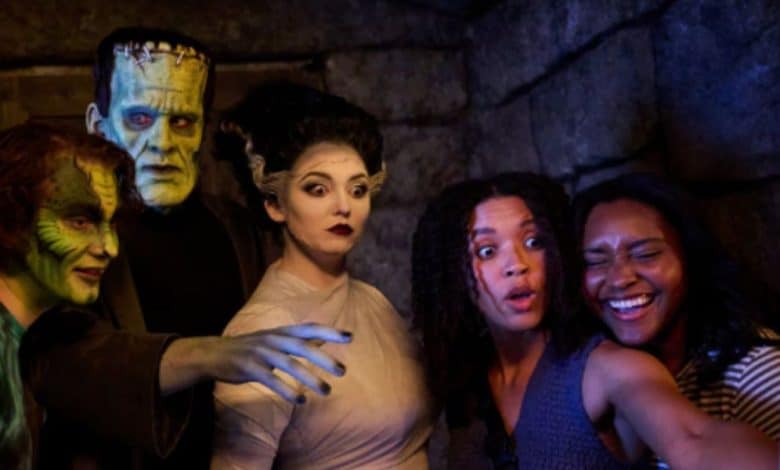 epic universe universal guests take a selfie with frankenstein and his bride in dark universe