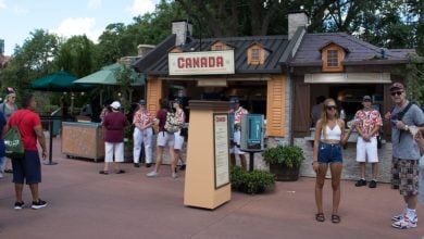 Guests gather at the Canada World Showcase Pavilion food kiosk during the EPCOT International food & Wine Festival