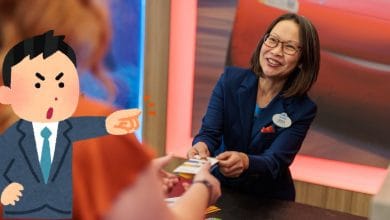 A cheerful front desk Cast Member hands a MagicBand to a guest at Disney World, while an animated character, resembling Donald Duck, gestures angrily in the foreground.