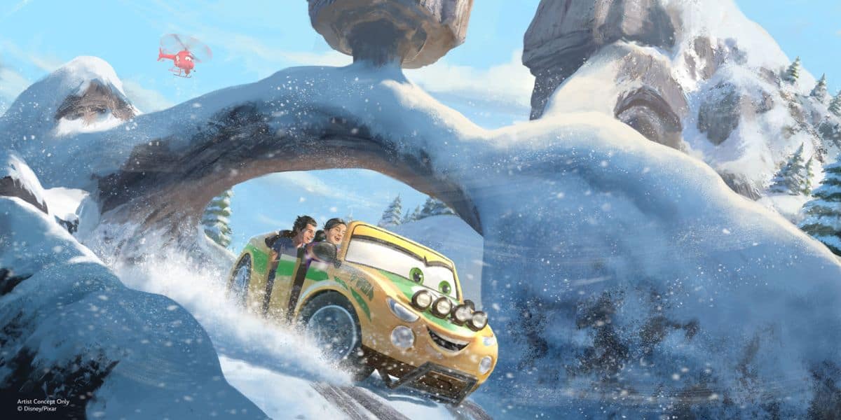 Lightning McQueen and friends race across snowy mountain tracks as a red Rescue Squad Mater helicopter soars overhead, bringing Radiator Springs excitement to life.