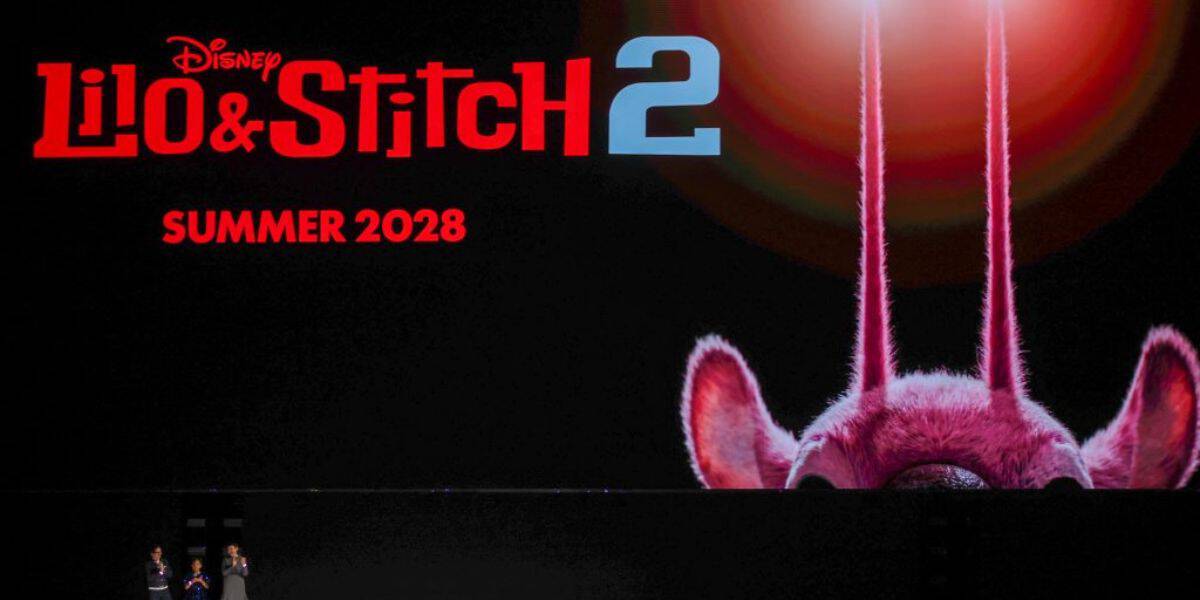 Stitch’s signature ears and antennae highlight the Lilo & Stitch 2 teaser unveiled at the D23 2026 Entertainment Showcase, with the Disney logo displayed. Fans and parkgoers get a first look at this animated sequel ahead of its summer 2028 release announcement.