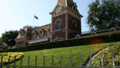 A fence blocks the Disneyland train station at the park entrance.