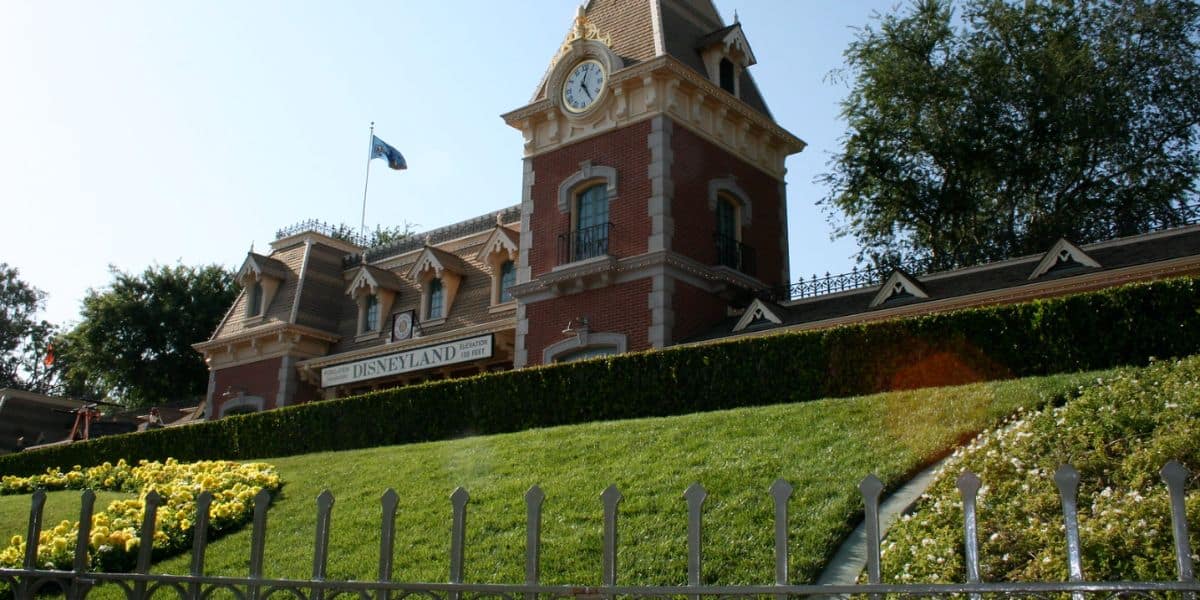 A fence blocks the Disneyland train station at the park entrance.