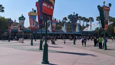 Guests in the esplanade between the entrance to Disneyland Park and the entrance to Disney California Adventure Park