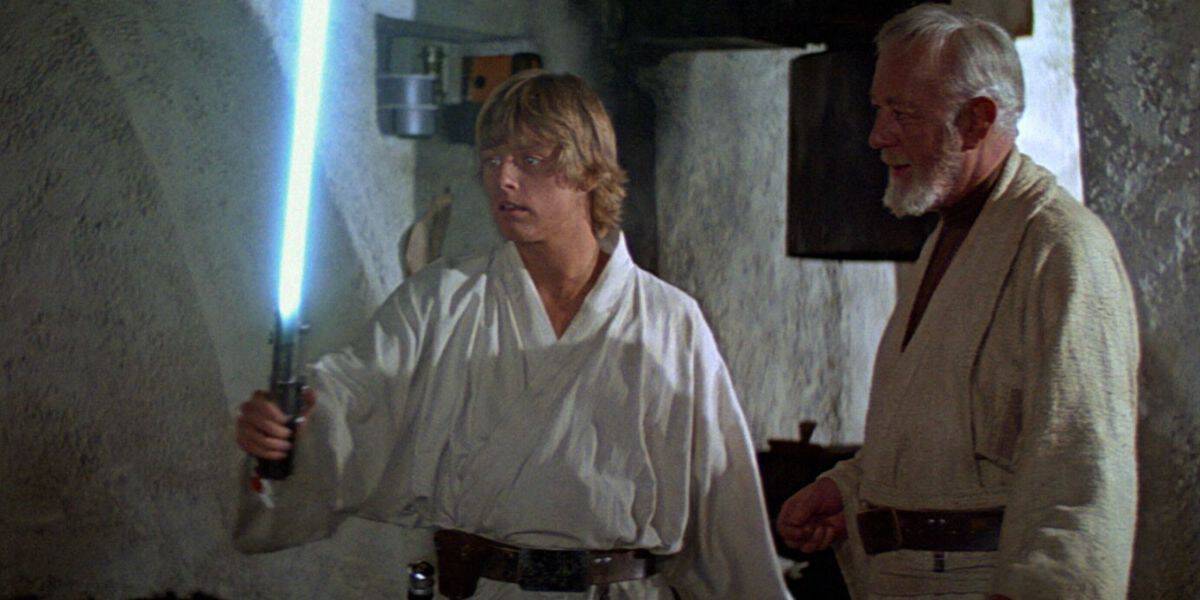 luke skywalker holds blue lightsaber in 'star wars'