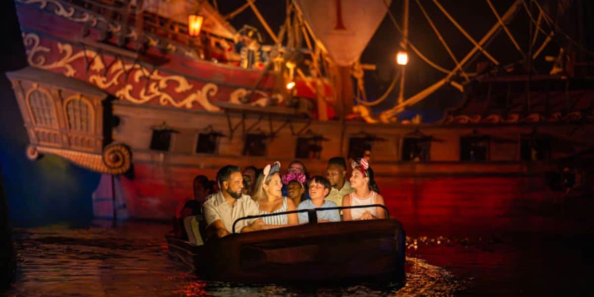 guests ride pirates of the caribbean in disney world's magic kingdom park