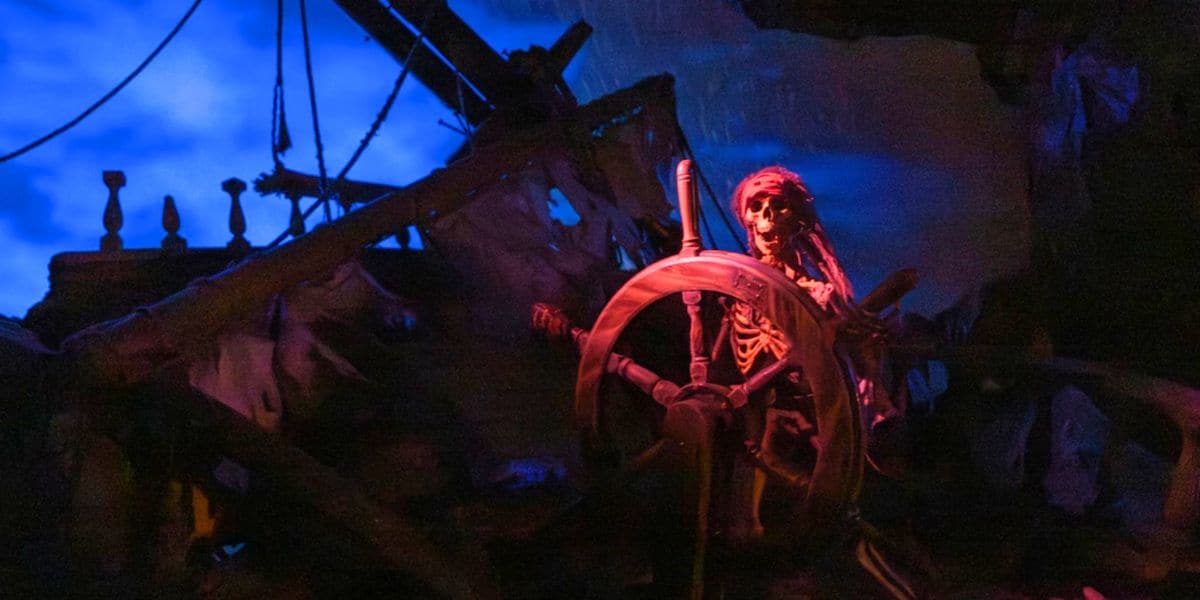 skeleton driving ghost ship on pirates of the caribbean ride in disney world's magic kingdom