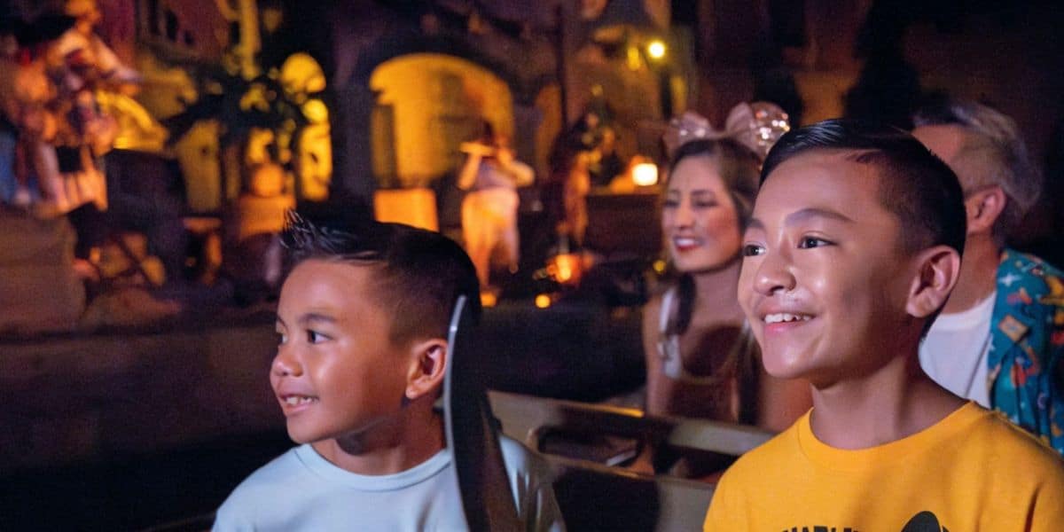 guests ride pirates of the caribbean ride in magic kingdom disney world