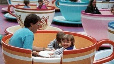 Guests spin and laugh together on the classic Mad Tea Party ride at Disneyland