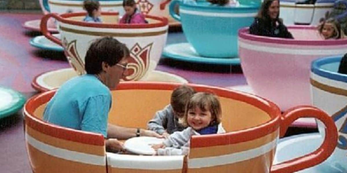 Guests spin and laugh together on the classic Mad Tea Party ride at Disneyland