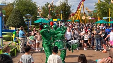 Green Army Men march and drum through Toy Story Land at Disney’s Hollywood Studios, entertaining guests.