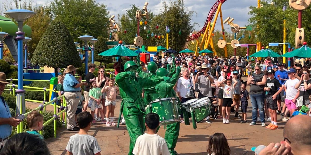 Green Army Men march and drum through Toy Story Land at Disney’s Hollywood Studios, entertaining guests.