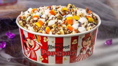 Buttered popcorn with mini marshmallows, candy corn, Halloween sprinkles, and milk chocolatey drizzle for Halloween at Disney World