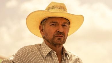 Billy Bob, dressed in a straw cowboy hat and a striped shirt, poses outdoors beneath a dramatic, cloud-filled sky—capturing the rugged spirit featured in Paramount’s Landman series.