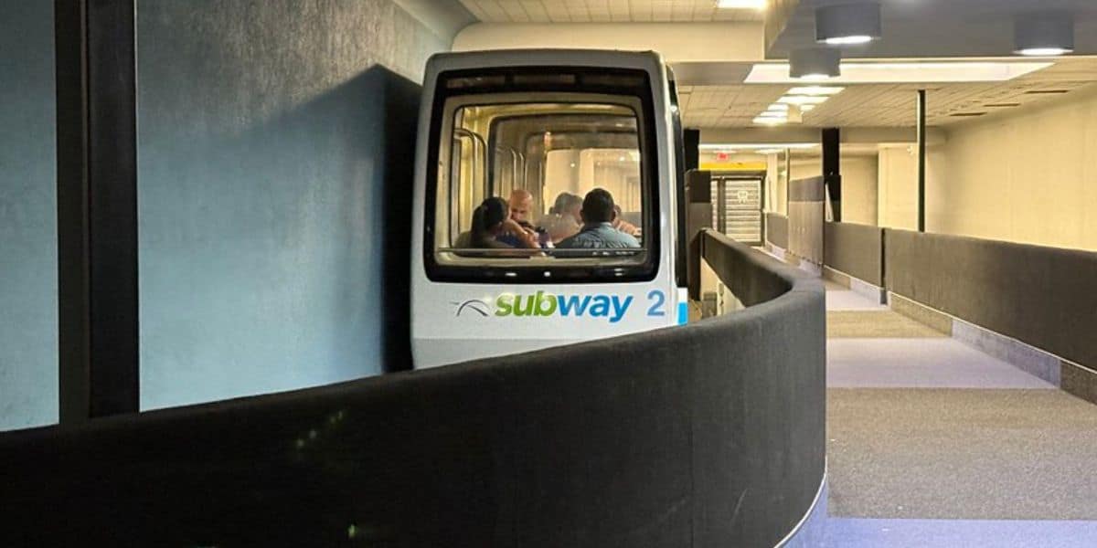 A Cincinnati/Northern Kentucky International Airport terminal train car, featuring a PeopleMover-style ride system.