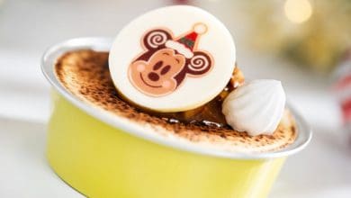 Crème brûlée topped with a festive holiday Mickey Mouse chocolate medallion and a meringue dollop at Disney.