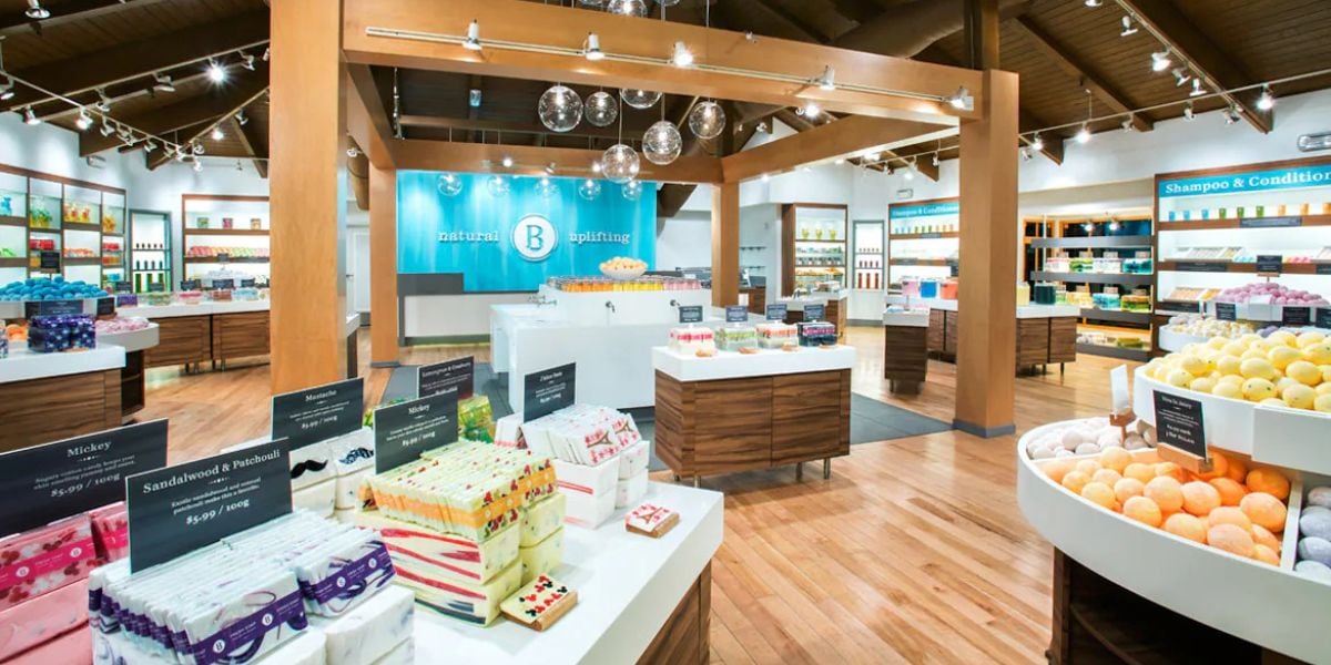 Inside a Basin store at Disney BoardWalk, showcasing displays of handmade soaps and bath bombs.