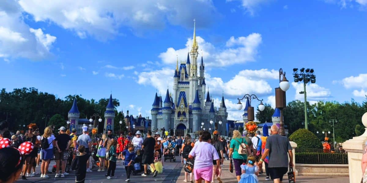 Disney World guests around Cinderella Castle at Magic Kingdom
