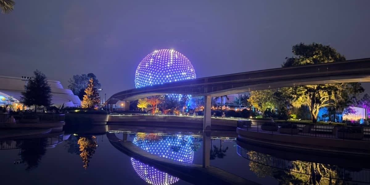 Spaceship Earth glowing at night at EPCOT