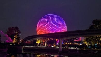 Spaceship Earth lit up at night at EPCOT