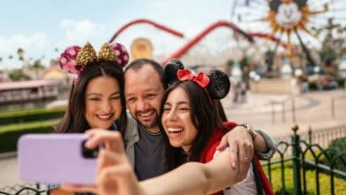 Disneyland Resort guests take selfie in front of incredicoaster