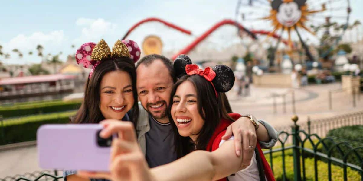 Disneyland Resort guests take selfie in front of incredicoaster