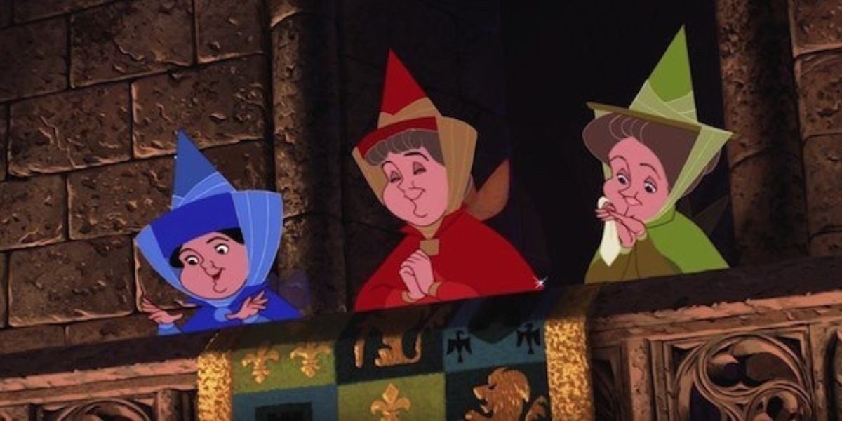 Flora, Fauna, and Merryweather leaning over a stone balcony in 'sleeping beauty'