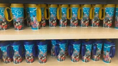 Walt Disney World 50th anniversary refillable mugs on display at a resort quick-service location.