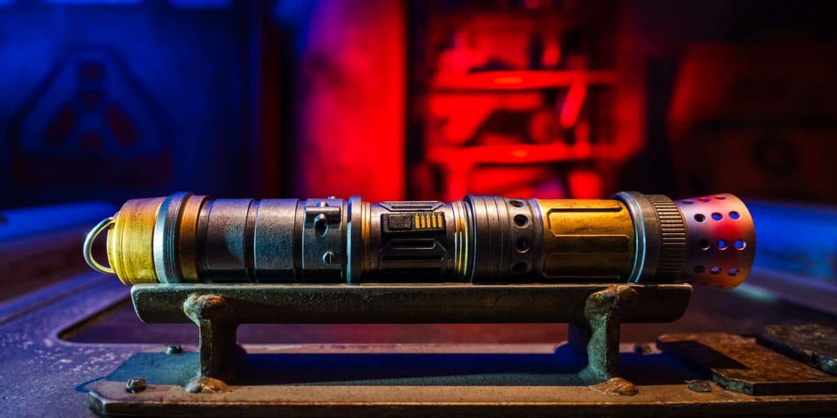 Custom Savi’s Workshop lightsaber hilt on display